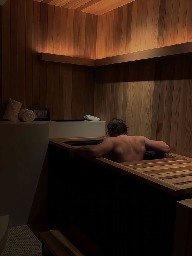 A wooden sauna, warmly lit