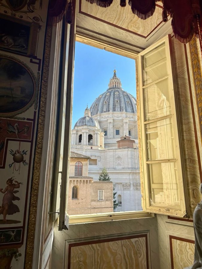 The dome of St Peter's framed by an open window