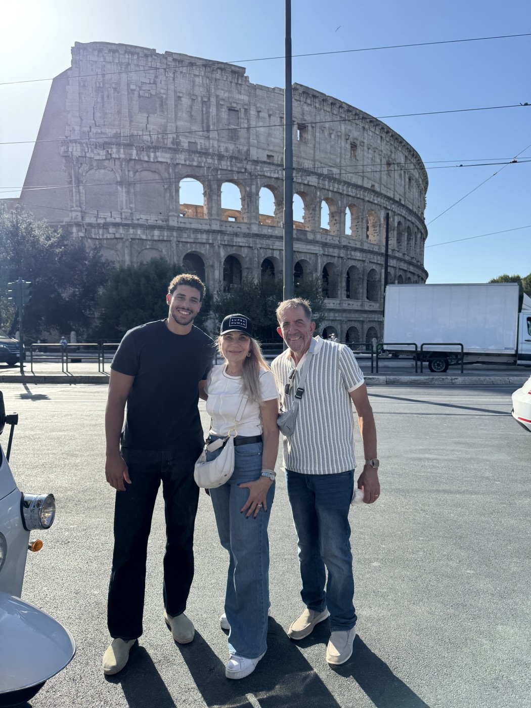 Jeannette and her family in front of the Colosseum